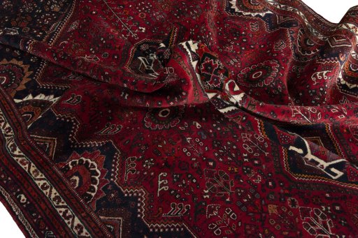 Surface texture of 2000s Shiraz rug with natural Wool and intricate pattern