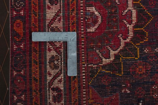 Backside of handmade 2000s Shiraz rug showing knot structure and weave density