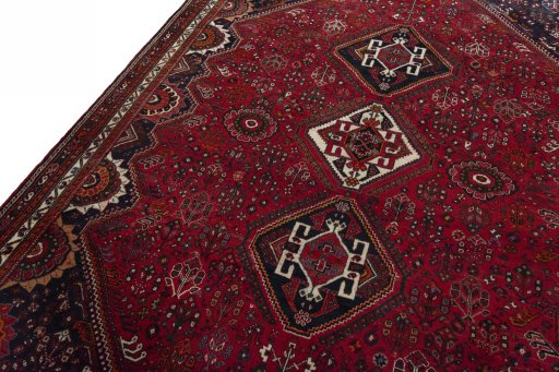 Backside of handmade 2000s Shiraz rug showing knot structure and weave density