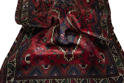 Corner detail of 2000s Shiraz rug showing border pattern and Wool pile