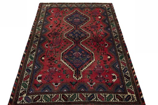 Surface texture of 2000s Shiraz rug with natural Wool and intricate pattern