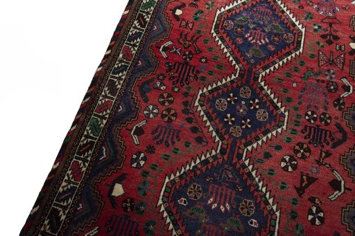 Backside of handmade 2000s Shiraz rug showing knot structure and weave density