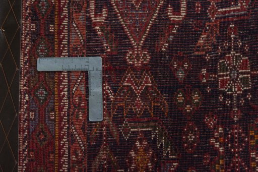 Backside of handmade 1970s Shiraz rug showing knot structure and weave density