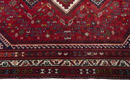 Corner detail of 2000s Shiraz rug showing border pattern and Wool pile