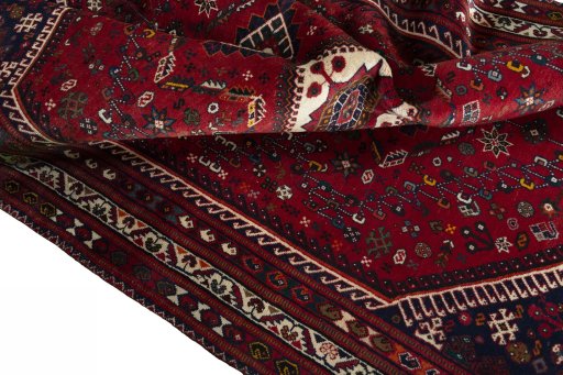 Surface texture of 2000s Shiraz rug with natural Wool and intricate pattern