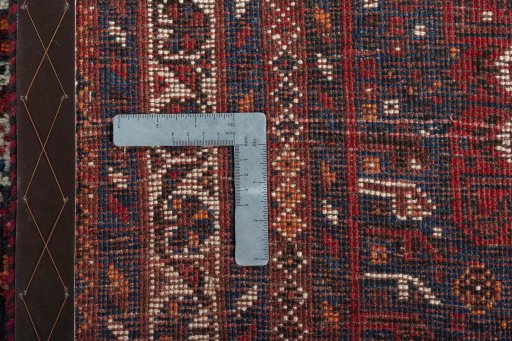 Backside of handmade 1970s Shiraz rug showing knot structure and weave density