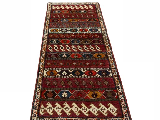 Surface texture of 2000s Shiraz rug with natural Wool and intricate pattern