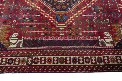 Corner detail of 2000s Shiraz rug showing border pattern and Wool pile