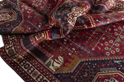 Surface texture of 2000s Shiraz rug with natural Wool and intricate pattern