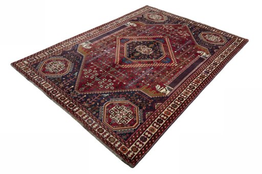 Corner detail of 2000s Shiraz rug showing border pattern and Wool pile