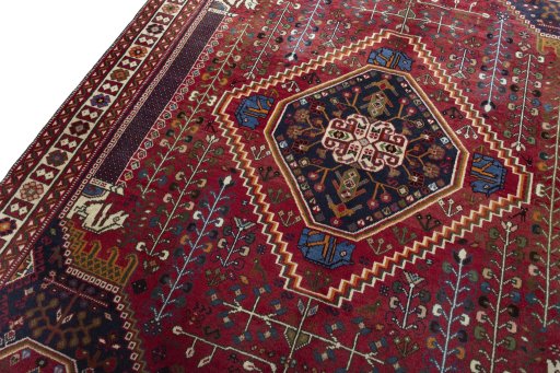 Backside of handmade 2000s Shiraz rug showing knot structure and weave density