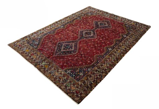 Corner detail of 2000s Shiraz rug showing border pattern and Wool pile