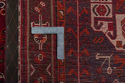 Surface texture of 2000s Shiraz rug with natural Wool and intricate pattern