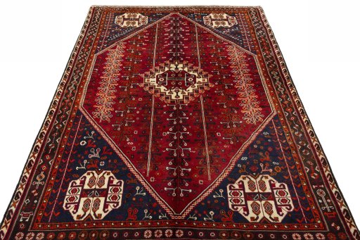 Surface texture of 2000s Shiraz rug with natural Wool and intricate pattern