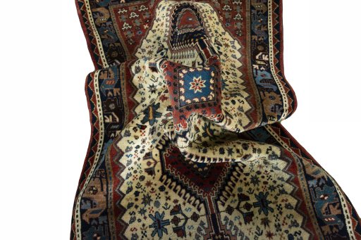 Corner detail of 2000s Shiraz rug showing border pattern and Wool pile