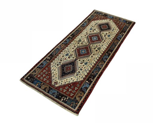 Corner detail of 2000s Shiraz rug showing border pattern and Wool pile