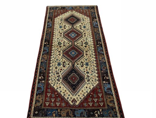 Surface texture of 2000s Shiraz rug with natural Wool and intricate pattern