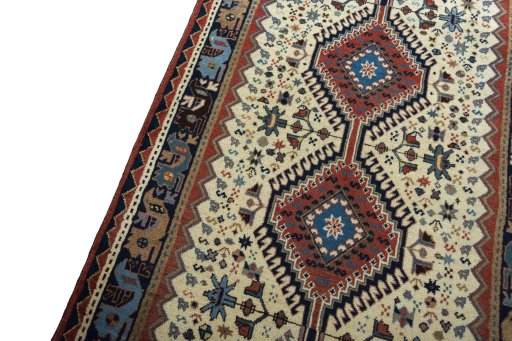 Backside of handmade 2000s Shiraz rug showing knot structure and weave density