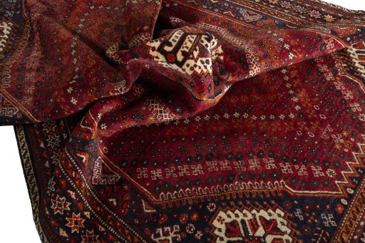 Surface texture of 2000s Shiraz rug with natural Wool and intricate pattern