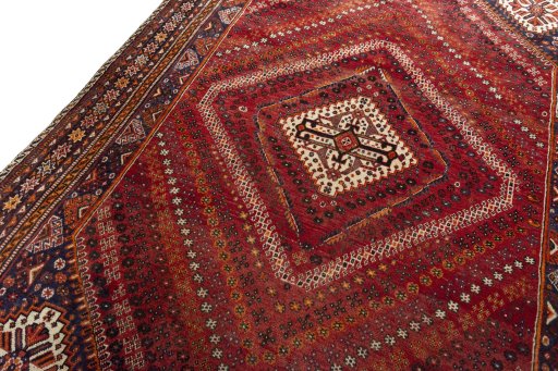Backside of handmade 2000s Shiraz rug showing knot structure and weave density