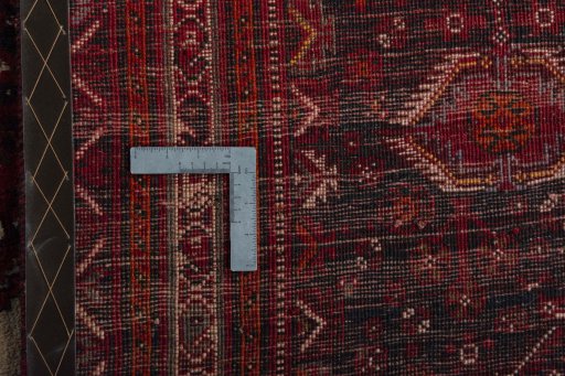 Backside of handmade 2000s Shiraz rug showing knot structure and weave density