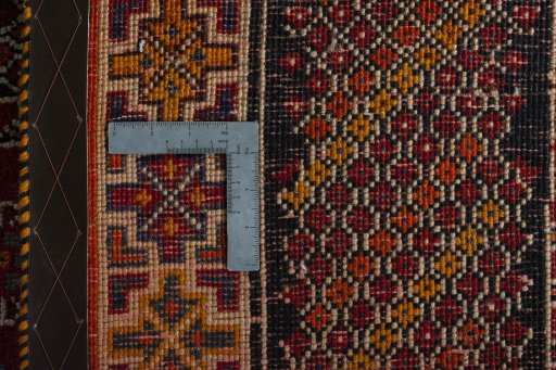 Surface texture of 2000s Shiraz rug with natural Wool and intricate pattern