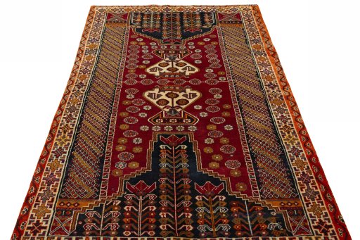 Surface texture of 2000s Shiraz rug with natural Wool and intricate pattern