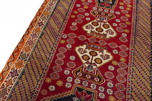 Backside of handmade 2000s Shiraz rug showing knot structure and weave density
