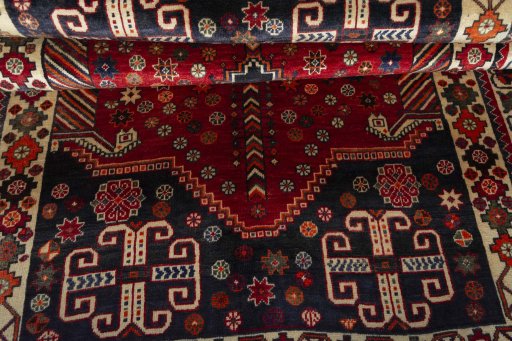 Corner detail of 2000s Shiraz rug showing border pattern and Wool pile