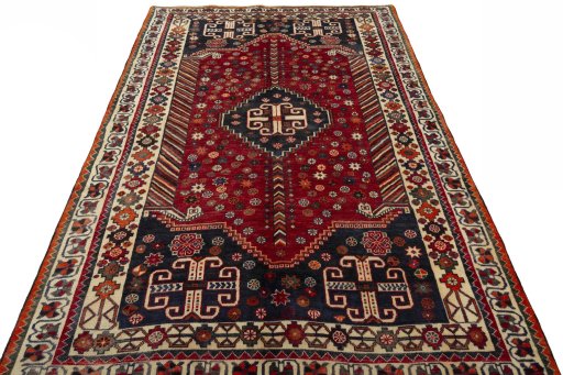 Surface texture of 2000s Shiraz rug with natural Wool and intricate pattern