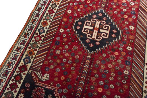 Backside of handmade 2000s Shiraz rug showing knot structure and weave density