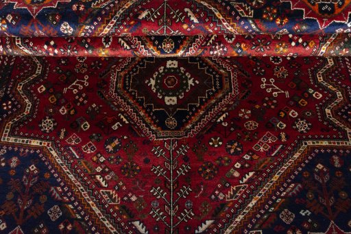 Corner detail of 2000s Shiraz rug showing border pattern and Wool pile