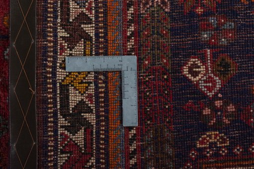 Surface texture of 2000s Shiraz rug with natural Wool and intricate pattern