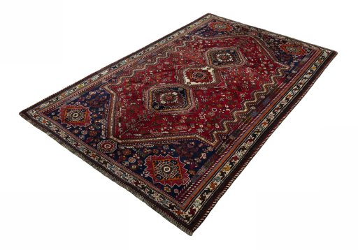 Corner detail of 2000s Shiraz rug showing border pattern and Wool pile