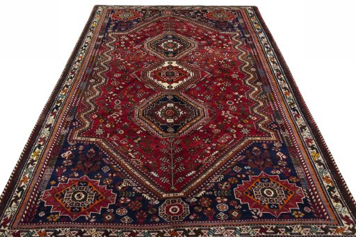 Surface texture of 2000s Shiraz rug with natural Wool and intricate pattern