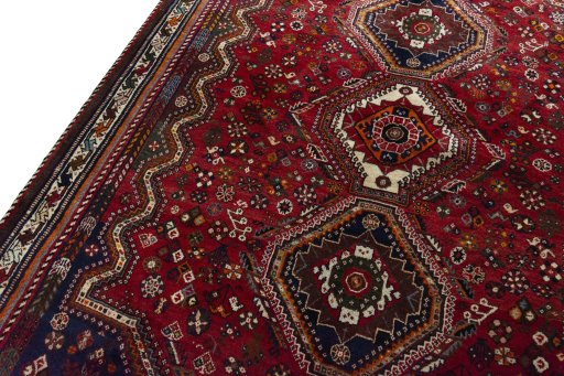 Backside of handmade 2000s Shiraz rug showing knot structure and weave density