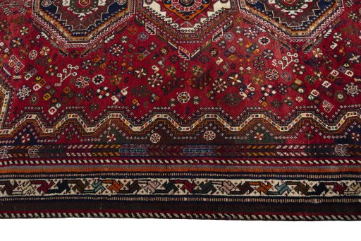 Full view of 2000s Shiraz rug from Iran / Persia, 287 × 185 cm in Red tones