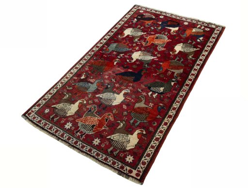 Corner detail of 2000s Shiraz rug showing border pattern and Wool pile