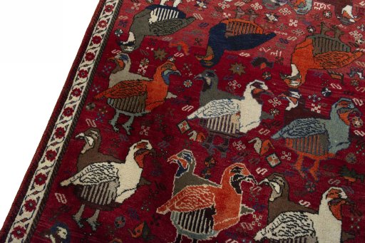 Backside of handmade 2000s Shiraz rug showing knot structure and weave density