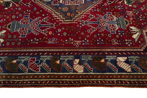 Corner detail of 2000s Shiraz rug showing border pattern and Wool pile