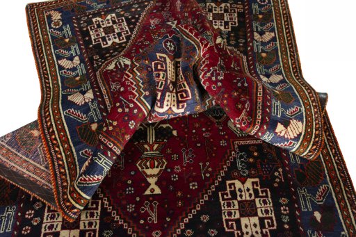 Surface texture of 2000s Shiraz rug with natural Wool and intricate pattern