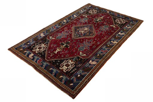Corner detail of 2000s Shiraz rug showing border pattern and Wool pile