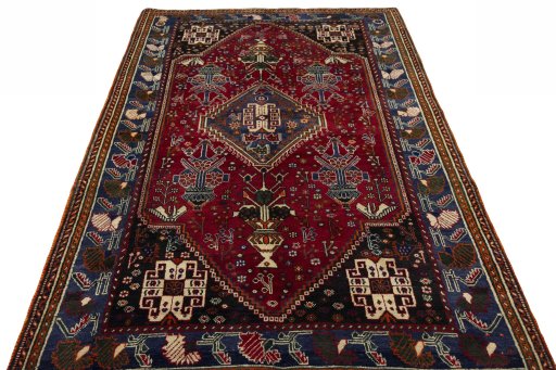 Surface texture of 2000s Shiraz rug with natural Wool and intricate pattern