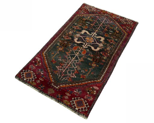 Corner detail of 2000s Shiraz rug showing border pattern and Wool pile