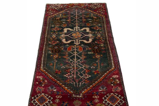 Surface texture of 2000s Shiraz rug with natural Wool and intricate pattern