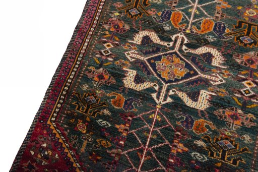 Backside of handmade 2000s Shiraz rug showing knot structure and weave density