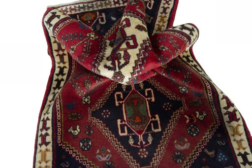 Corner detail of 2000s Shiraz rug showing border pattern and Wool pile