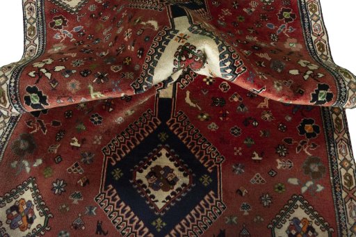 Corner detail of 2000s Shiraz rug showing border pattern and Wool pile