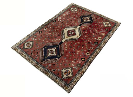 Corner detail of 2000s Shiraz rug showing border pattern and Wool pile