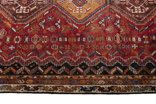 Full view of 2000s Shiraz rug from Iran / Persia, 283 × 180 cm in Red tones